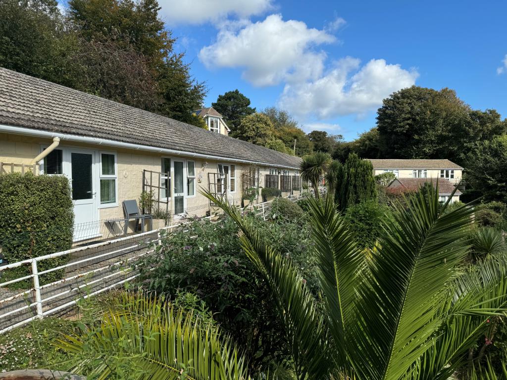 Lot: 59 - FREEHOLD GROUND RENTS FOR EXTENSIVE CHALET SITE - Chalets overlooking gardens